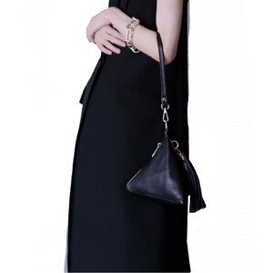 Laura DiMaggio black leather pyramid / triangle-shaped wristlet bag.